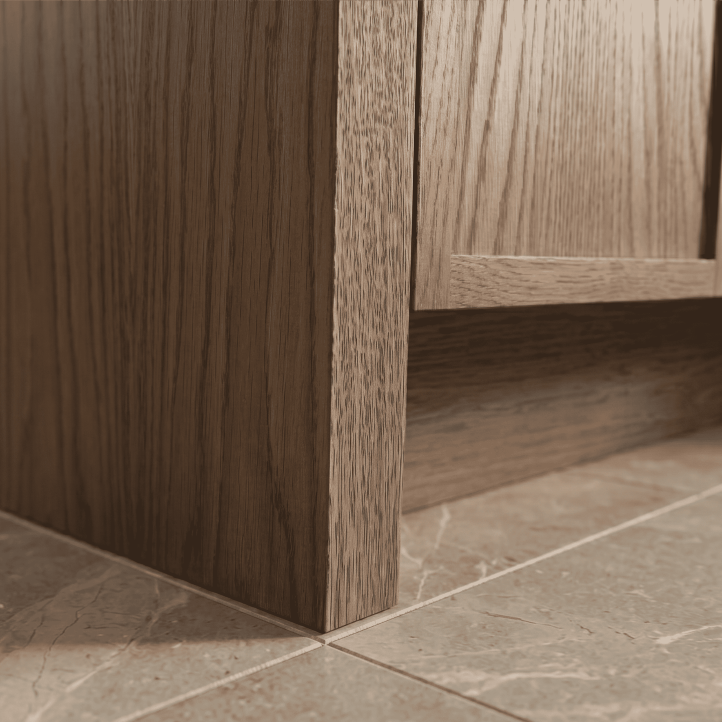Close-up of a wooden cabinet corner with a tiled floor. Rosseau 48" White Oak Wood Bathroom Vanity