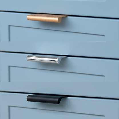 Close-up of blue drawers with gold, silver, and black handles.