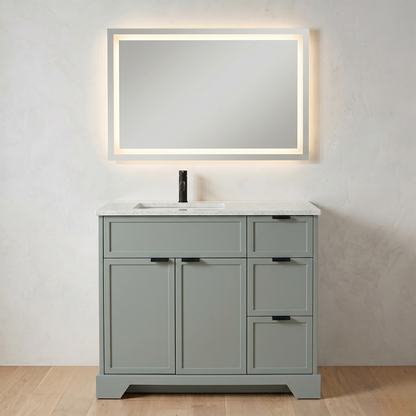 Gray bathroom vanity with white countertop and illuminated mirror on a light gray wall.