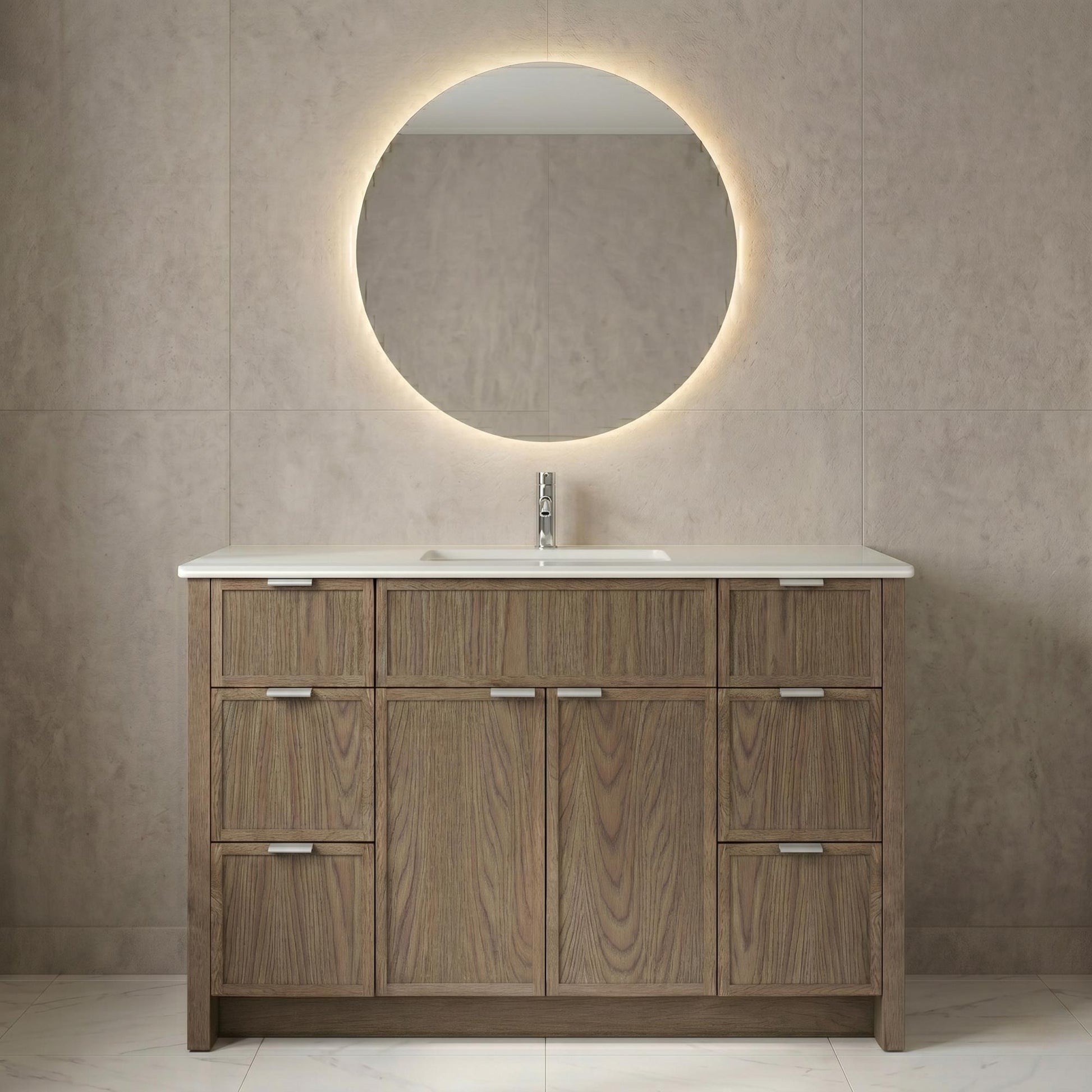Wooden bathroom vanity with round mirror and light fixture on a tiled wall.
