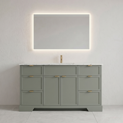 Gray bathroom vanity with marble countertop, sink, and illuminated mirror against a white wall.