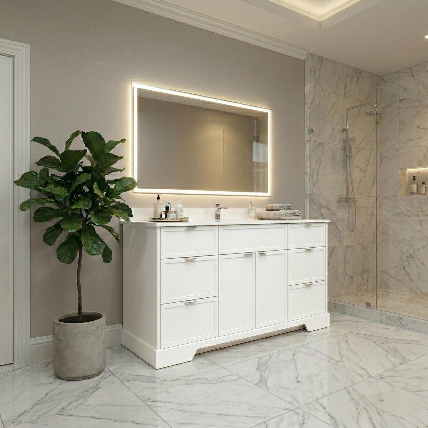 Modern bathroom with white vanity, illuminated mirror, and plant.