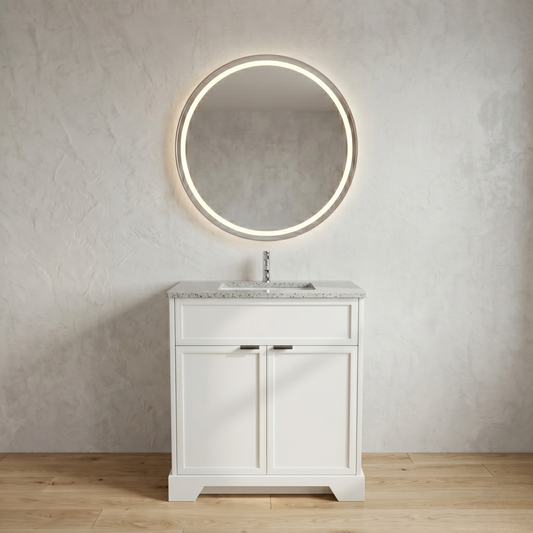 Bathroom vanity with round illuminated mirror against a neutral wall.