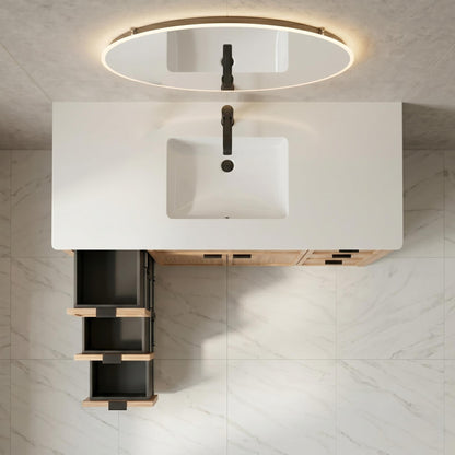 Bathroom vanity with white sink and open cabinet against a tiled wall.