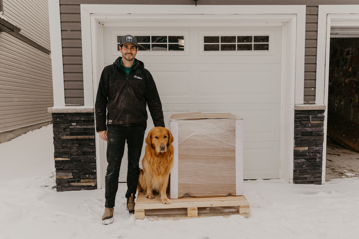 Ian McKee Owner of MCL Vanities with dog Rosseau