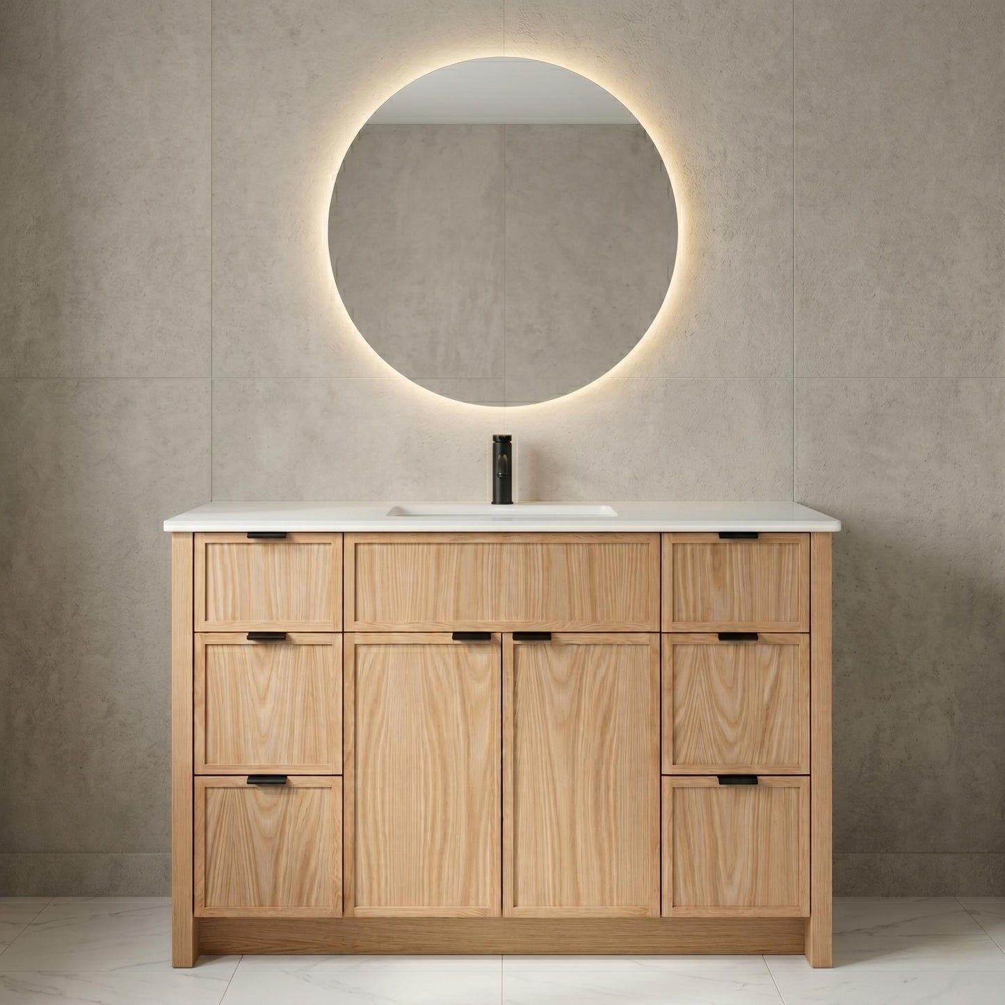 Bathroom vanity with wooden cabinets, round mirror, and white countertop against a beige tiled wall.