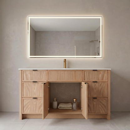 Bathroom vanity with open cabinet, illuminated mirror, and toiletries.